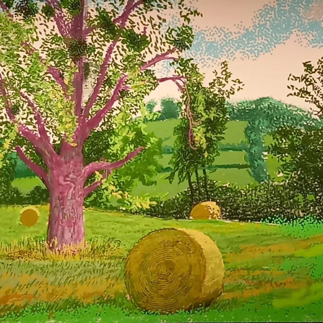 Détail d'une fresque illustrant l'été: un champ avec des rouleaux de paille avec des collines à l'arrière